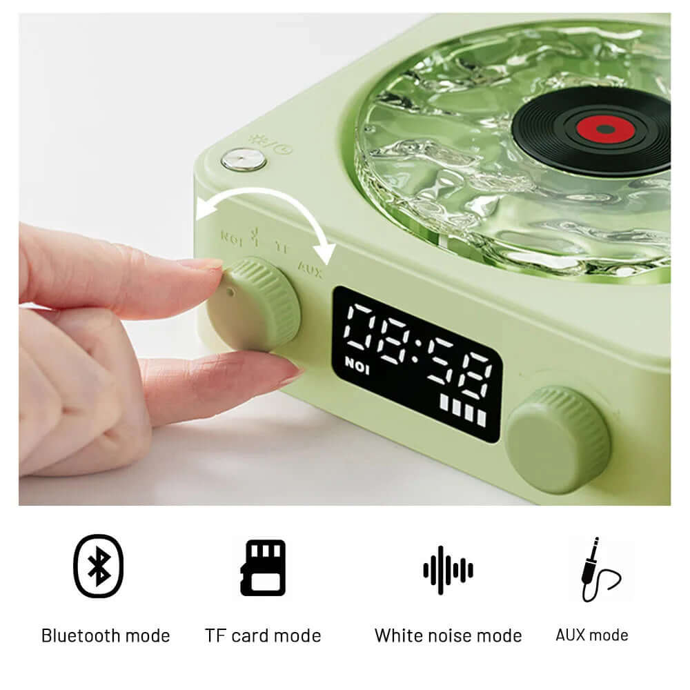 Close-up of retro turntable speaker controls showing Bluetooth, TF card, white noise, and AUX modes.