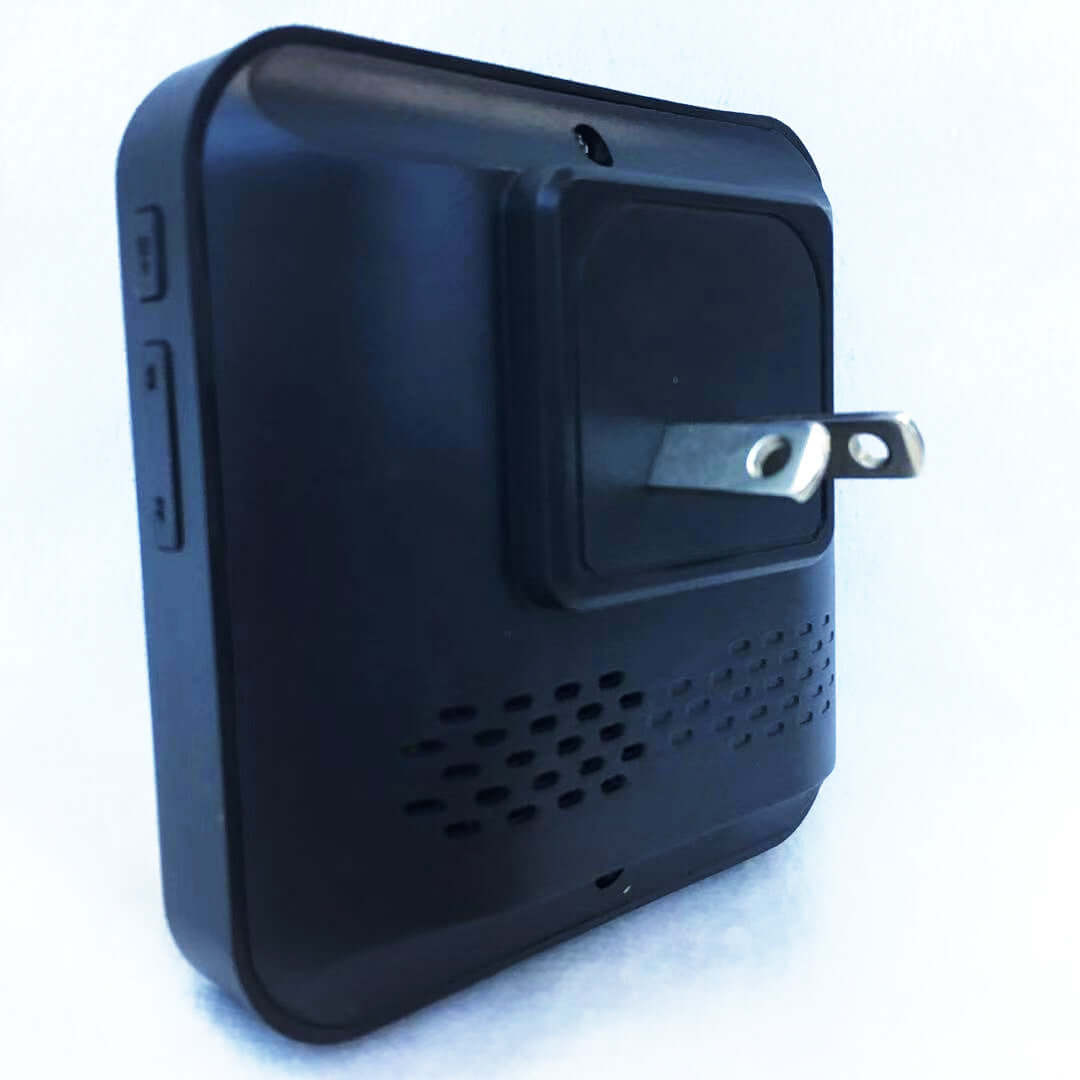 Close-up of a black wireless smart doorbell with a power plug, showcasing its sleek design.