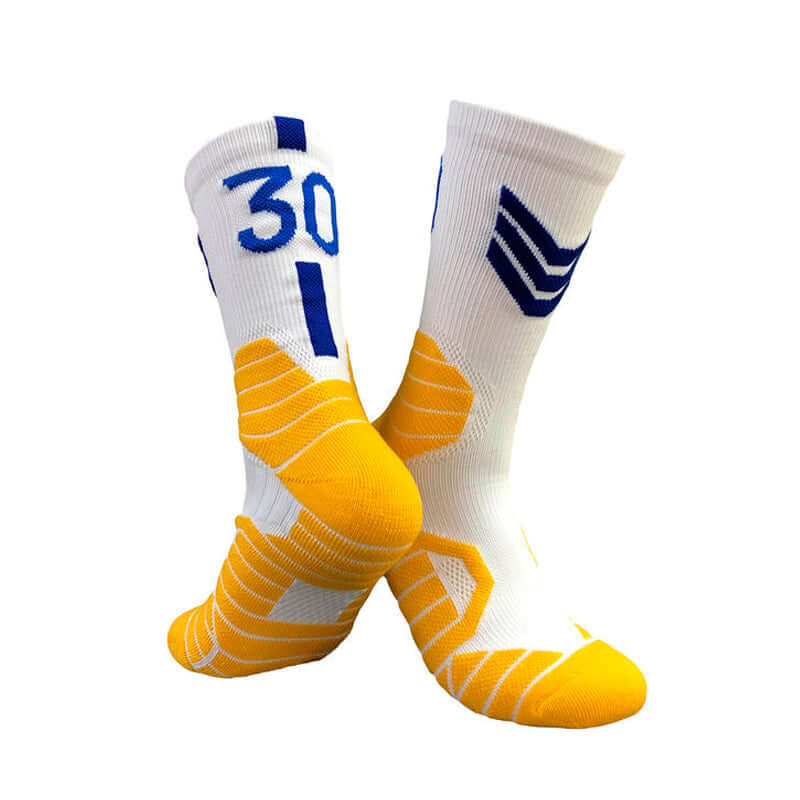 Superstar basketball socks featuring yellow and white design, suitable for adults and children ages 7-12, made from polyester and nylon.