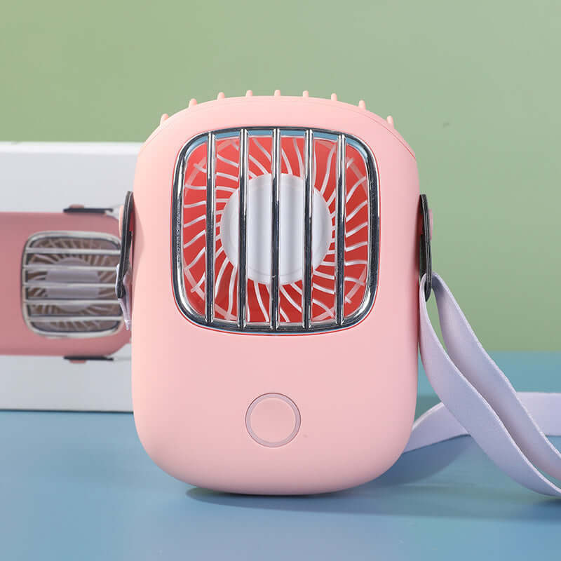USB portable fan in pink with adjustable strap, designed for portability and comfort.