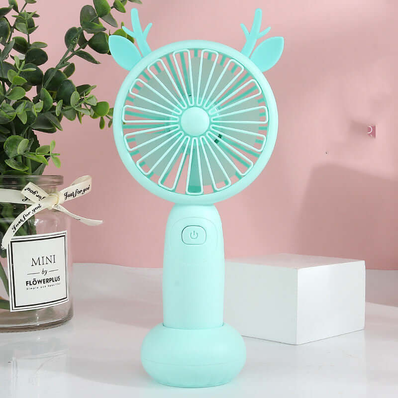 Mini turquoise USB fan with antlers, designed for portable cooling, ideal for outdoor use.