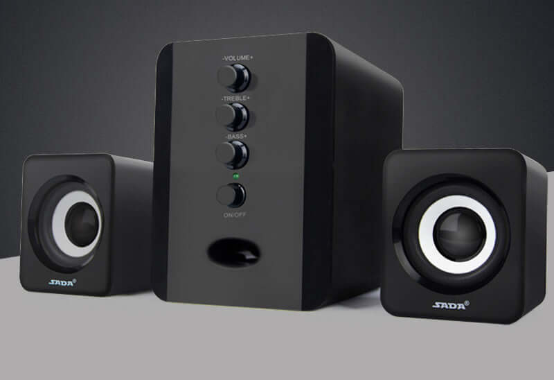 SADA D-202 computer speakers with subwoofer, featuring volume and bass controls in a sleek black design.