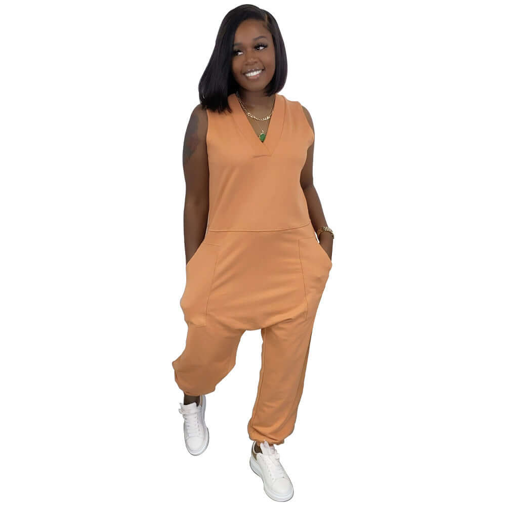 Fashionable sleeveless orange jumpsuit for women, featuring a casual style with pockets and a relaxed fit.