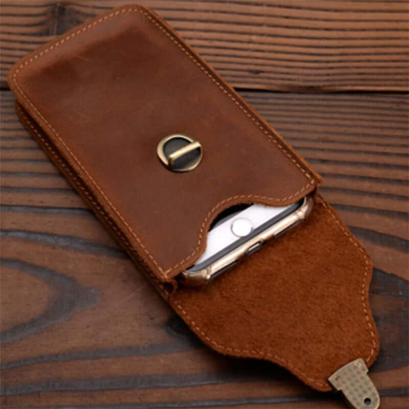 Brown leather mobile phone bag, clamshell style, protective cover for outdoor and home storage.