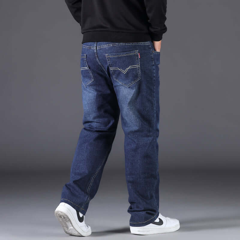 Men's fashion casual straight loose-fitting jeans in blue, featuring a solid color and displayed from the back.