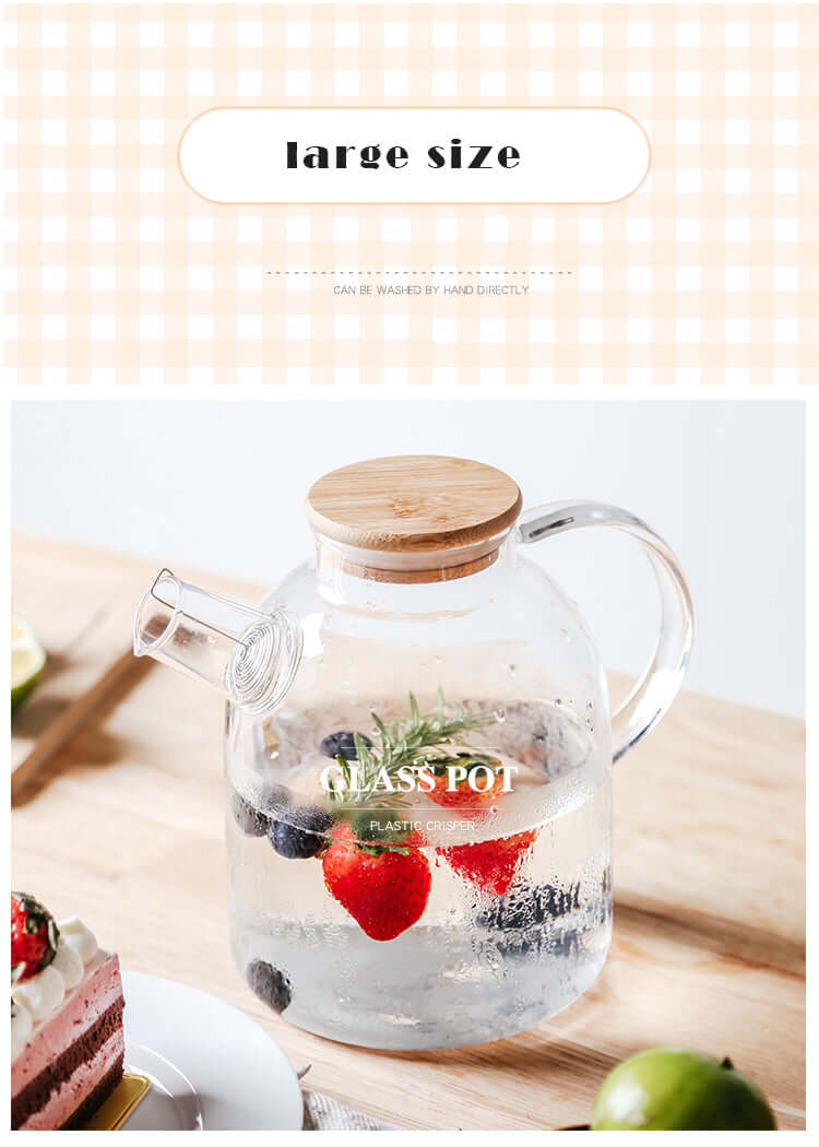 Nordic style glass pot with bamboo lid, featuring strawberries and blueberries, ideal for serving tea or beverages.