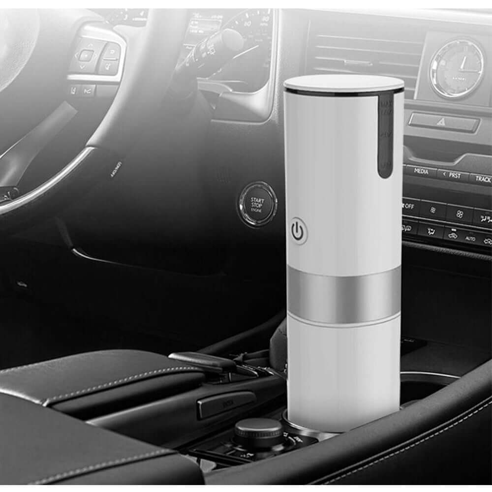 Portable coffee machine in car cup holder, perfect for enjoying coffee on-the-go.