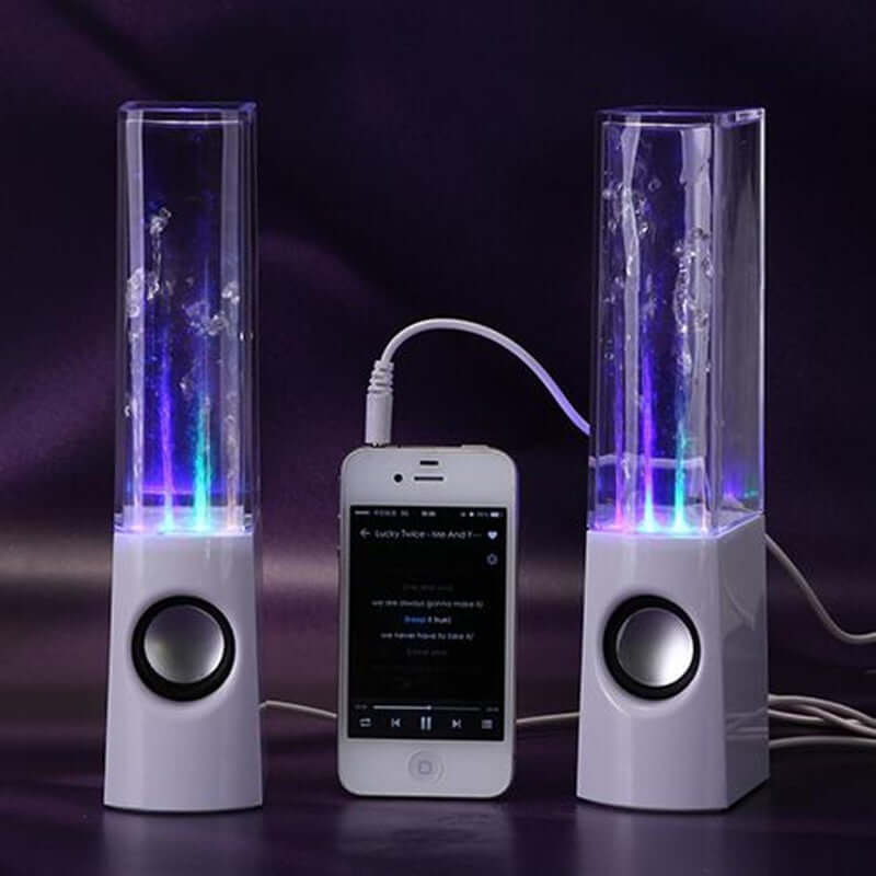 Wireless dancing water speakers with LED lights and a phone connected, perfect for home parties.
