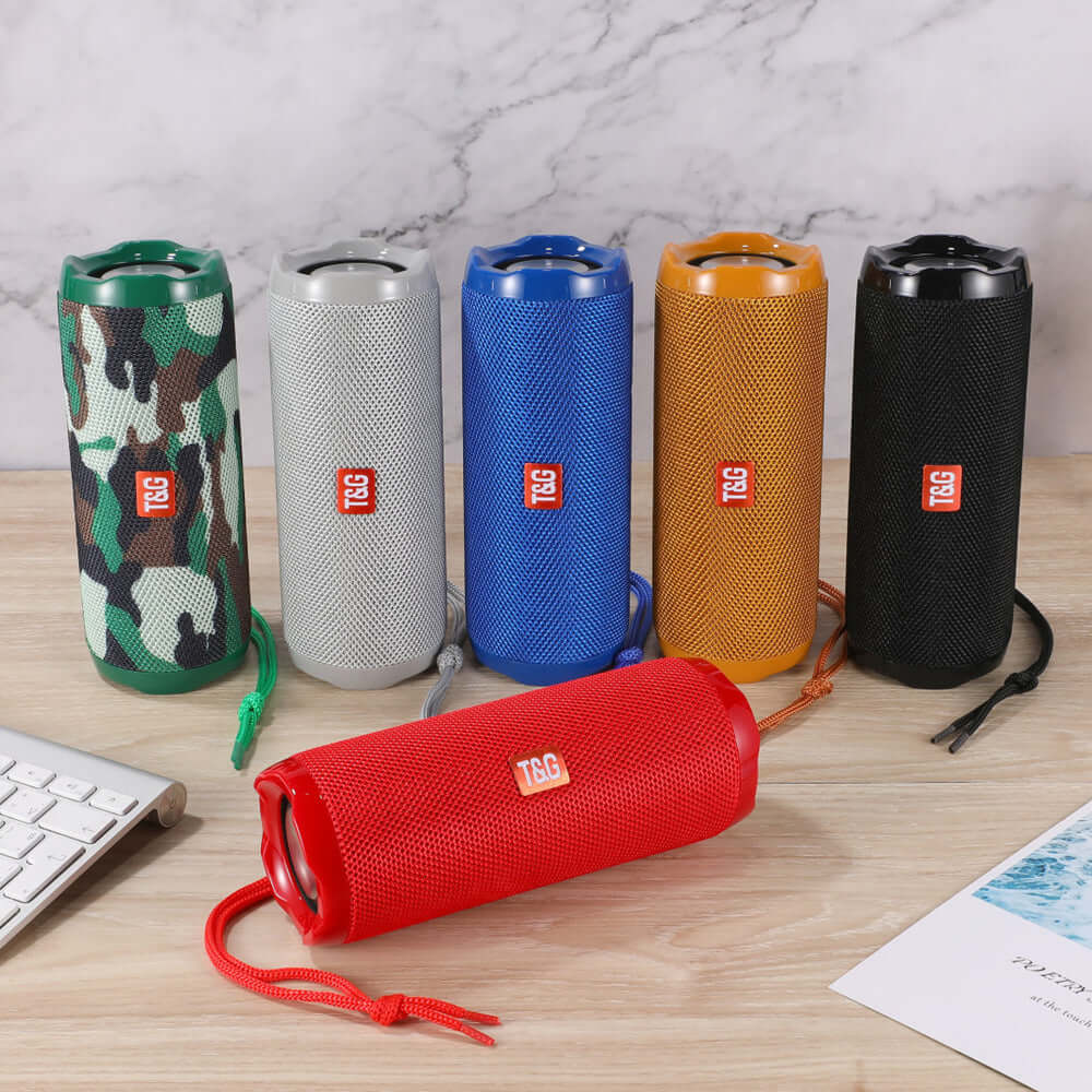 Colorful portable Bluetooth speakers in various colors with card holder, ideal for outdoor use or travel.