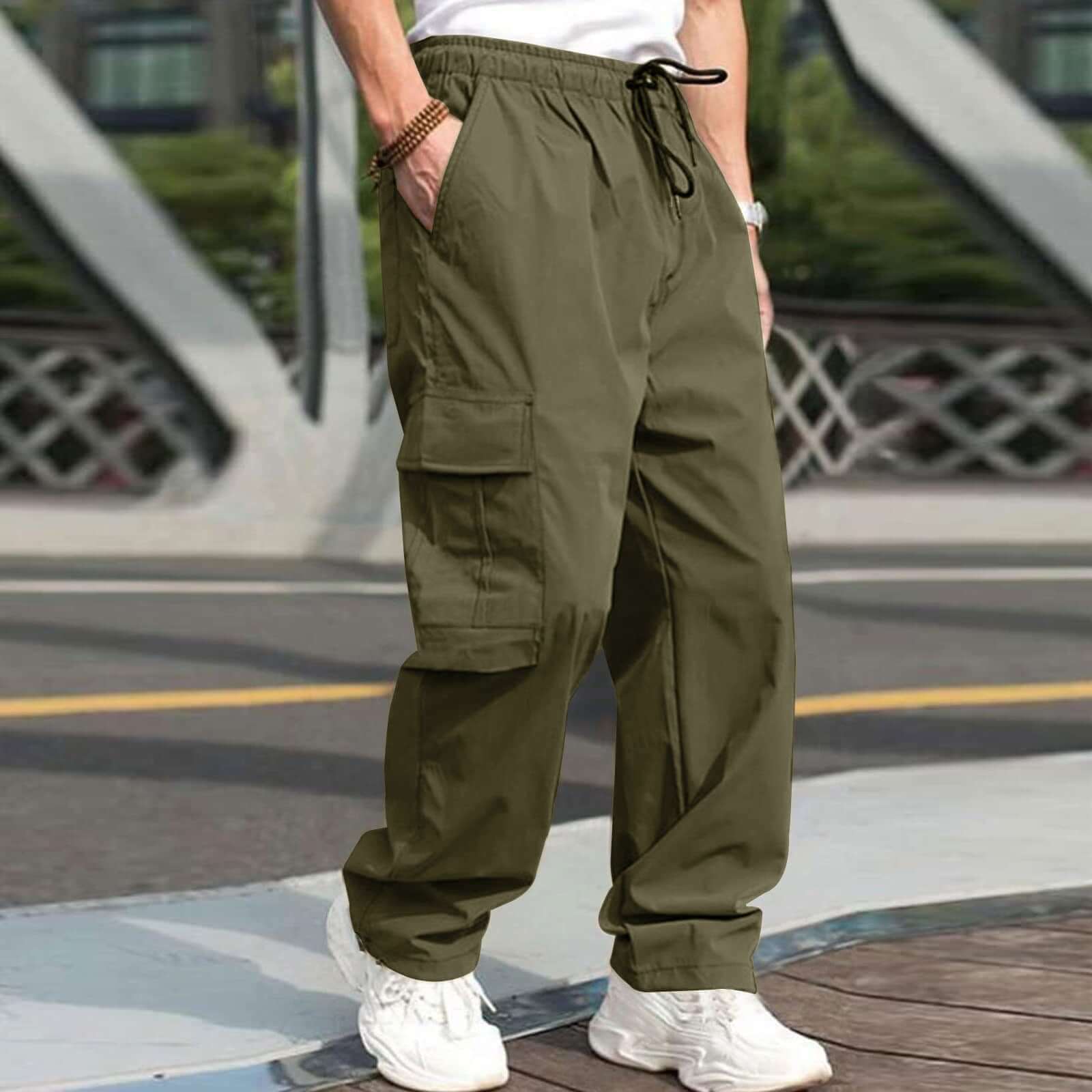 Men's loose straight casual cargo pants in army green with drawstring waist and pockets, perfect for stylish outdoor wear.