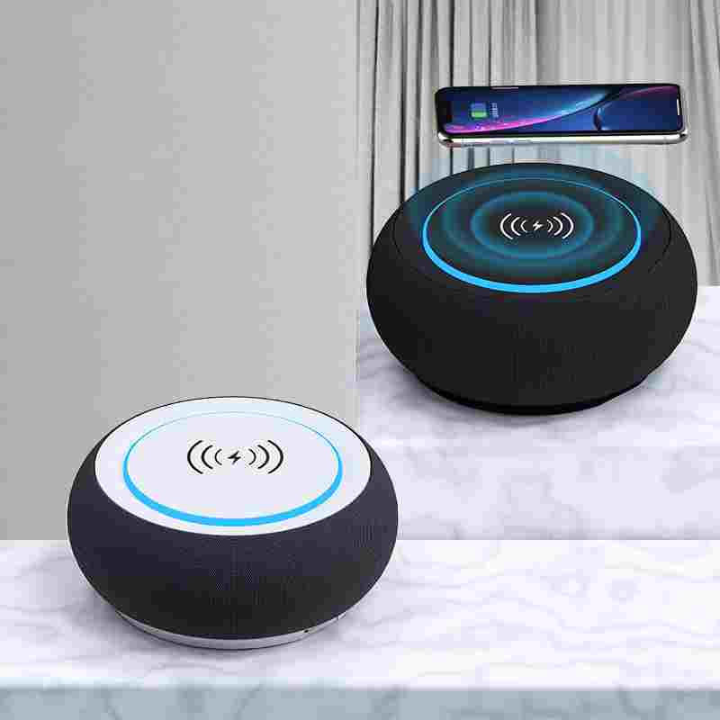 Wireless Bluetooth speaker with dual speakers and subwoofer, showcasing phone charging feature, waterproof design.
