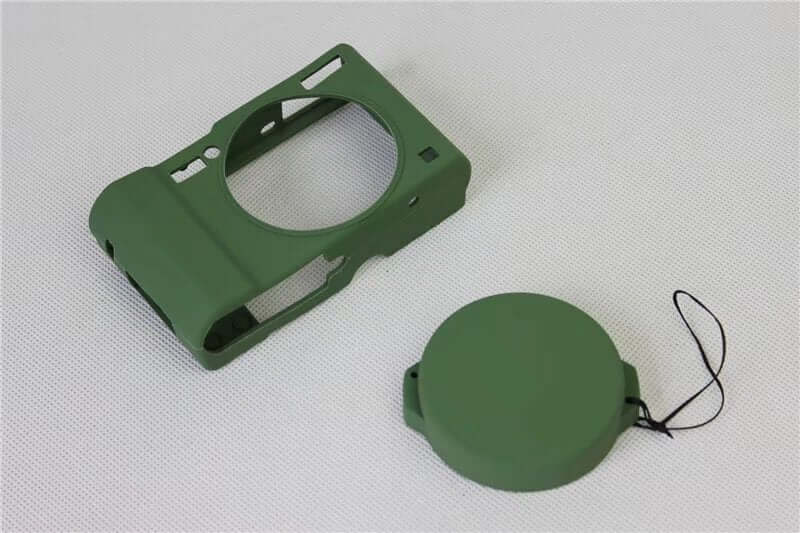 Green silicone soft case camera bag with removable lid, designed for shockproof protection and breathable use.