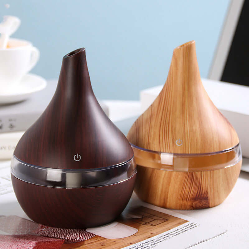 Wood grain tip humidifier air purifier in light and dark wood finishes, ideal for household use. USB powered, stylish design.