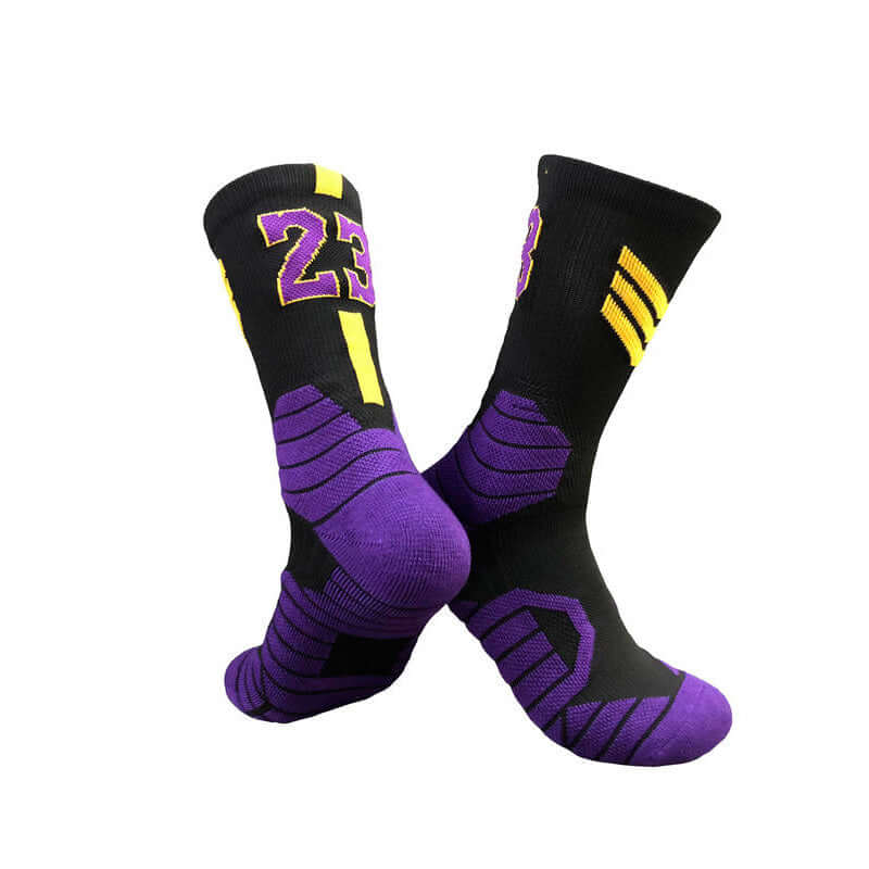 Superstar basketball socks in black and purple with yellow accents, perfect for adult and youth athletes.