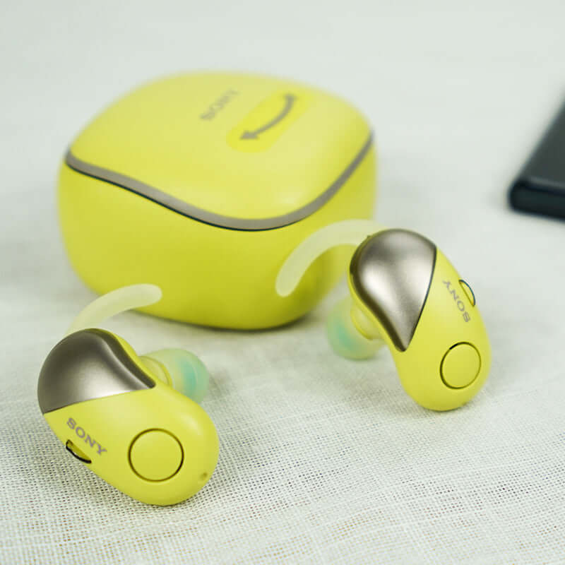 True Wireless In-ear Bluetooth Noise-canceling Headphones in yellow with charging case, featuring waterproof design and voice control.