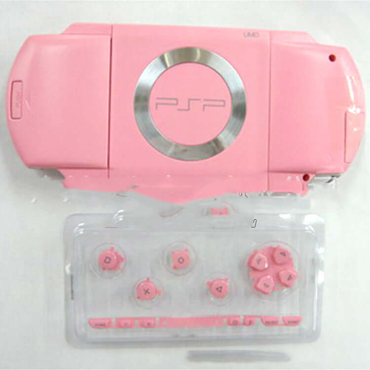 Pink PSP1000 handheld console with protective shell and buttons, suitable for gamers seeking stylish protection.
