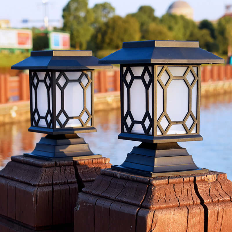 Solar powered lamps in courtyard garden with geometric design, providing bright white light by the water.