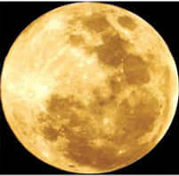 Close-up of a glowing yellow moon, showcasing its craters and textures, perfect for night lamp projections.