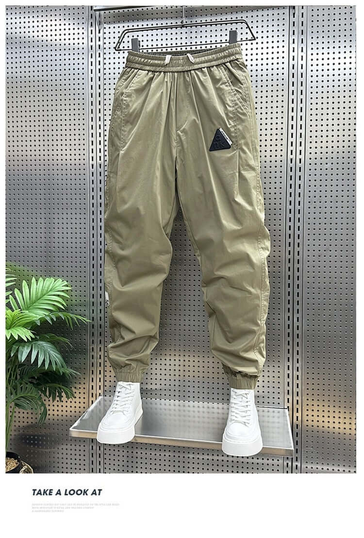 Men's cropped cargo pants in khaki with ankle banded style, perfect for leisure wear.