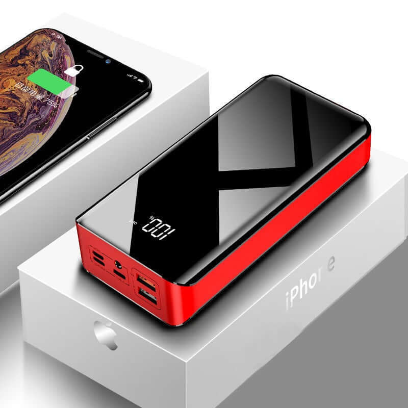 30000mAh power bank with LCD display, charging an iPhone, on a white box. Compact design and double-sided UV paint finish.