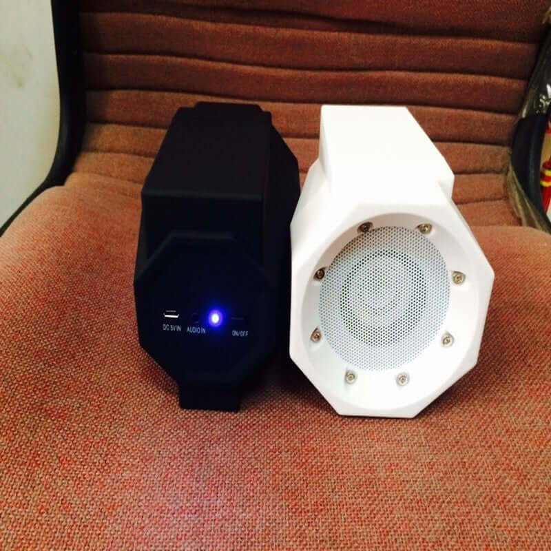 Smart Magnetic Induction Resonance Speaker in black and white, featuring a sleek design and power indicator light.