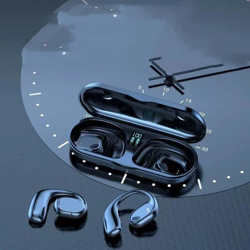 Black wireless headphones in charging case on a sleek surface with digital battery display.