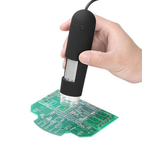 USB microscope camera focusing on a printed circuit board for detailed inspection with adjustable lighting.