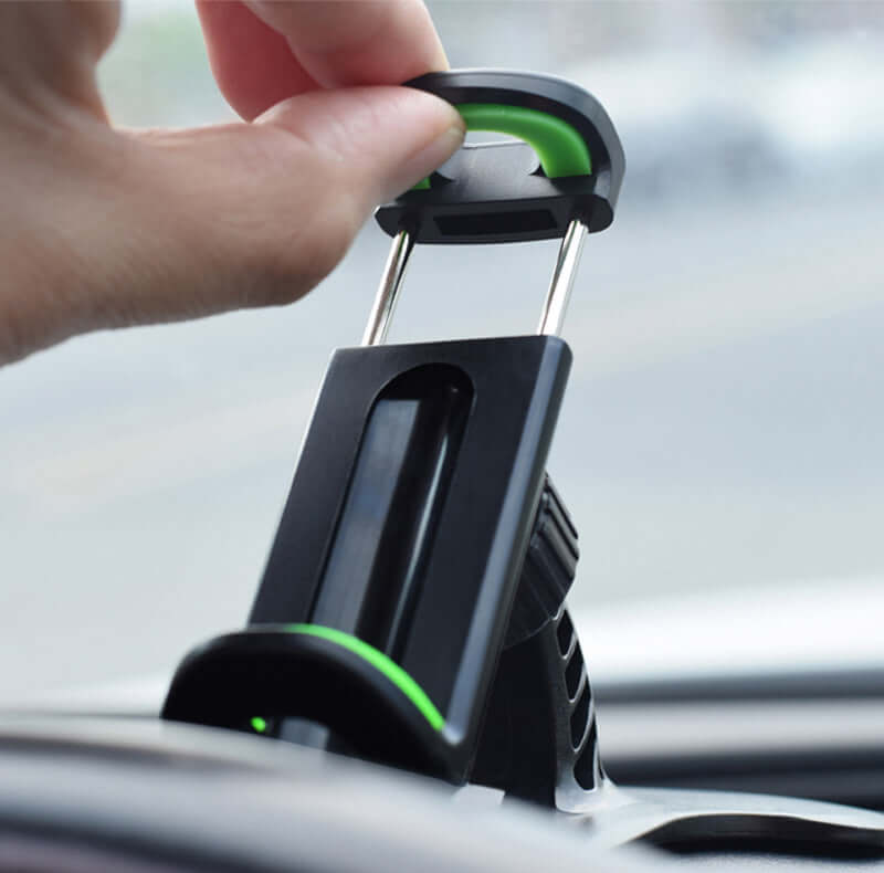 Hand adjusting the 360-degree rotation universal car phone holder on a dashboard for easy access and safety.