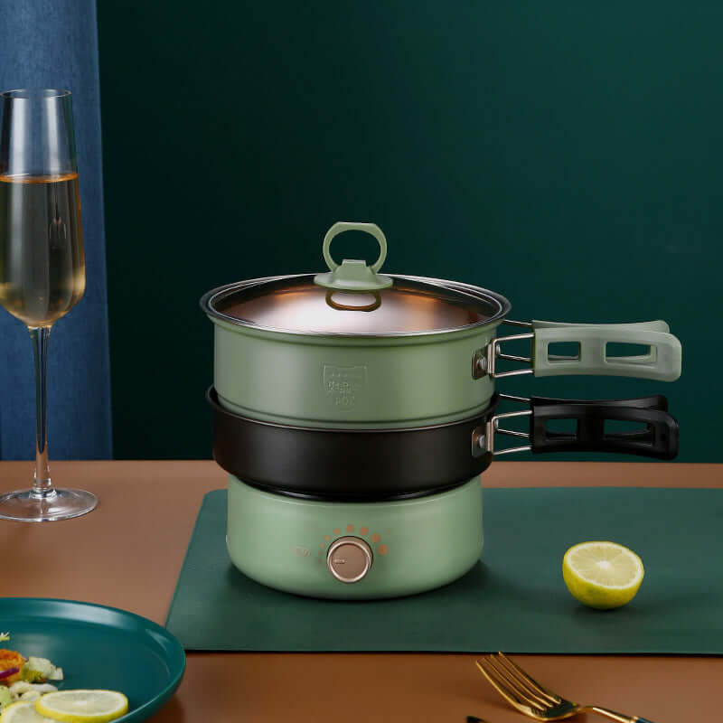 Cuisinière électrique with stainless steel pot and glass cover, perfect for cooking and steaming, 1.6L capacity.