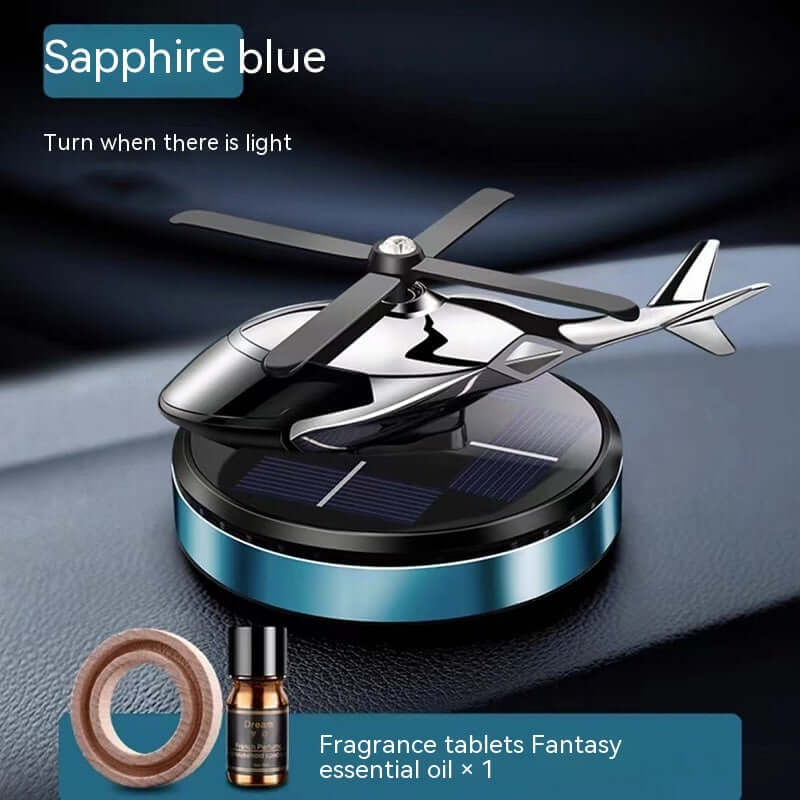 Sapphire blue helicopter car perfume holder with solar panel, essential oil, and fragrance tablets for decoration.