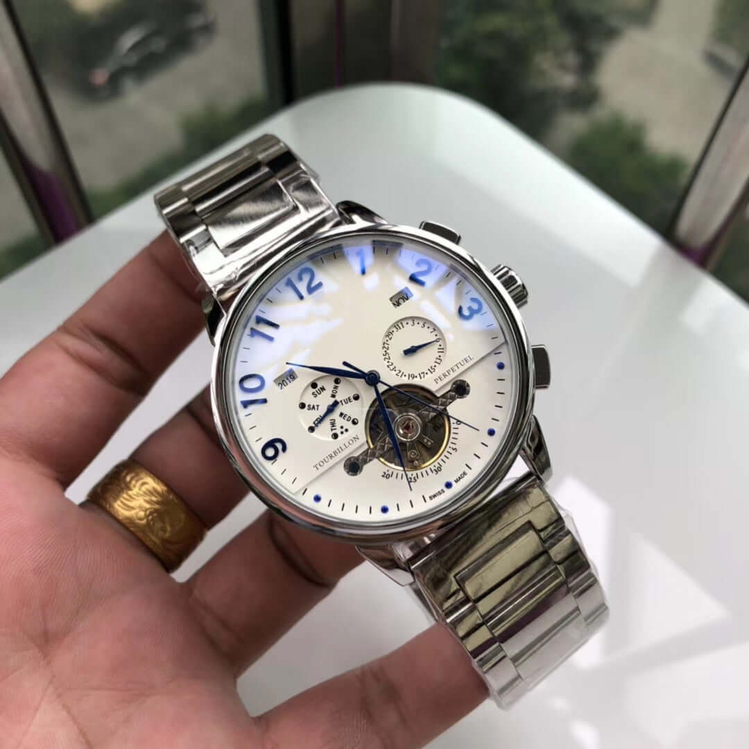 Elegant Big Flywheel mechanical watch with stainless steel strap, featuring a round dial and small three needles display.