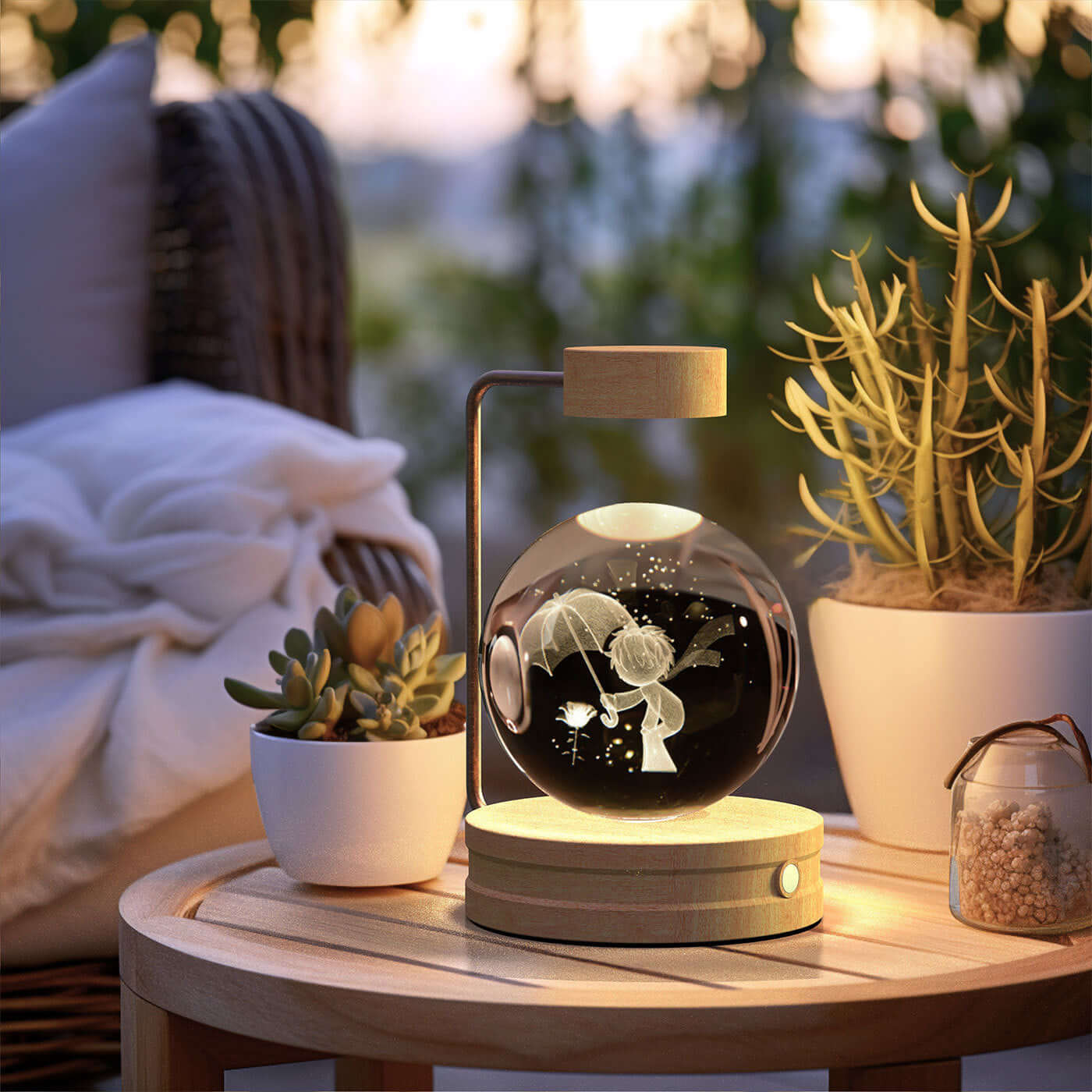 Crystal ball night light illuminating a cozy outdoor setting with plants, creating a warm atmosphere.