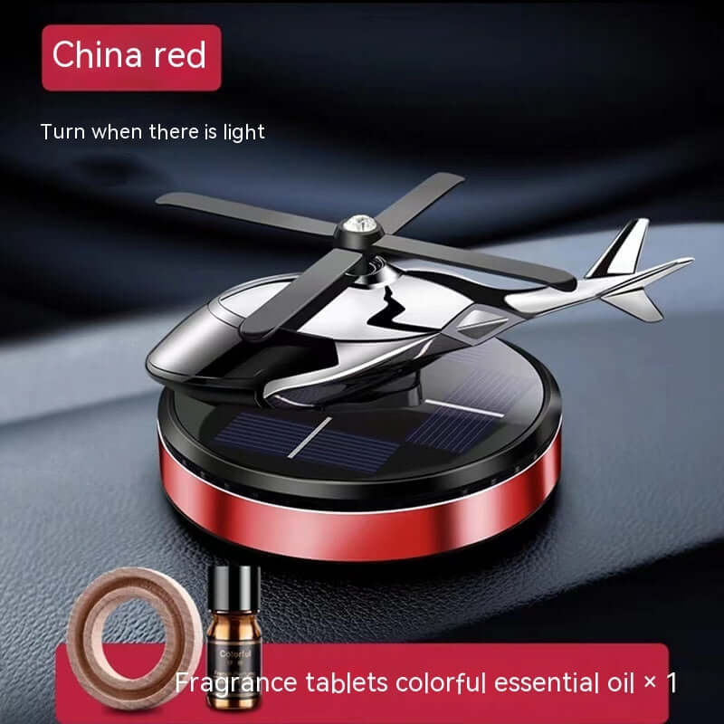 Aromatherapy helicopter car perfume holder with solar feature, colorful fragrance tablets, and stylish design.