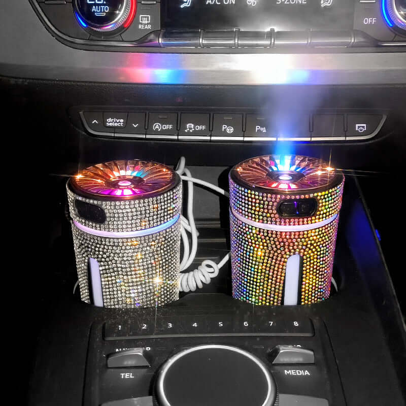 Luxury diamond car humidifiers in a vehicle cup holder, featuring LED lights and a stylish design.