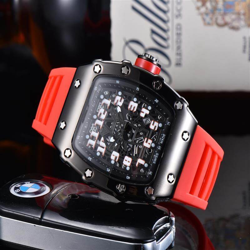 Stylish black and red quartz watch with oversized dial and rubber strap on a sleek background.