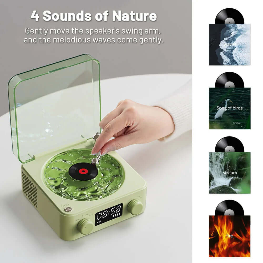 Hand operating retro turntable speaker with nature sounds, featuring a green design and vinyl records.