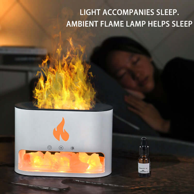 Ambient flame lamp creating a calming atmosphere for sleep with essential oil bottle nearby.