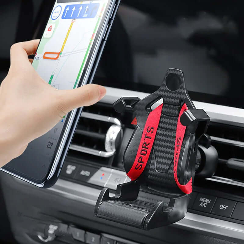 Racing seat shape car phone holder mounted in an air vent, providing 360-degree rotation and easy access for navigation.