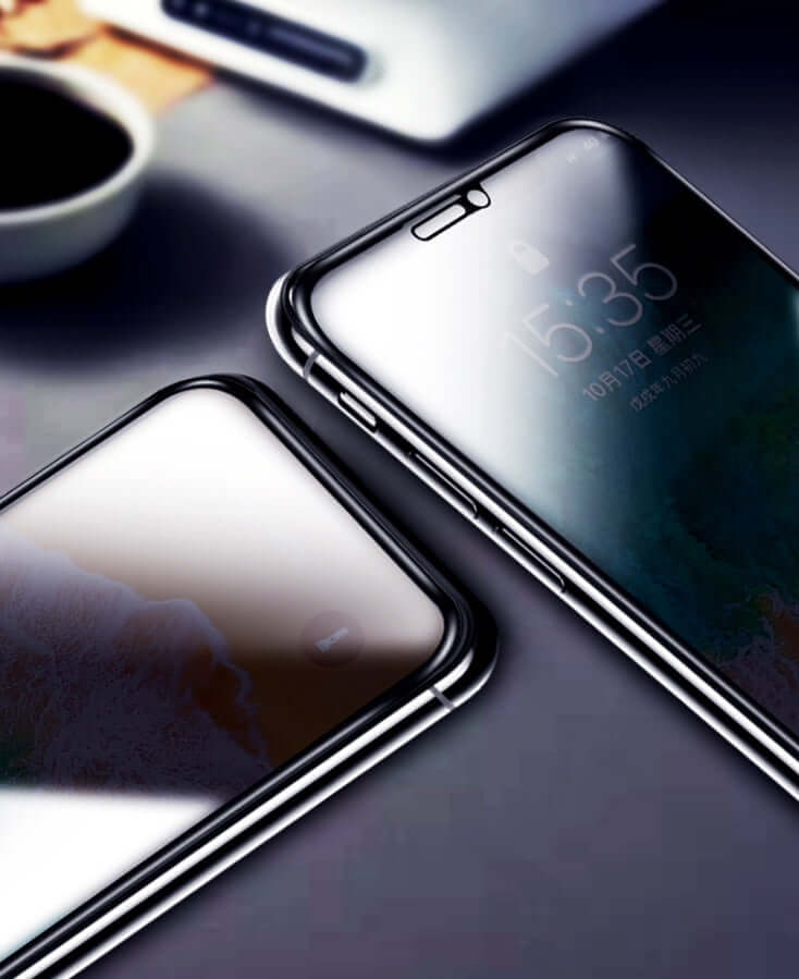 Close-up of two iPhones with tempered glass screen protectors, showcasing anti-scratch and anti-peeping features.