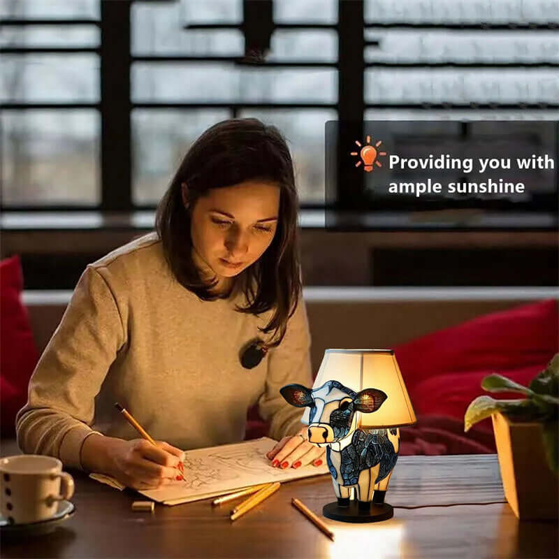 Charming cow table lamp providing ample light for studying and decorating your living room or bedroom.
