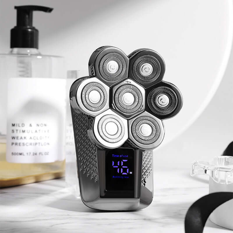 Men's five-in-one washable electric razor with LED display and floating cutter head on a stylish bathroom counter.