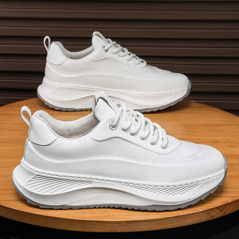 Men's thick-soled white sports shoes with lace-up design and breathable upper, perfect for casual wear.