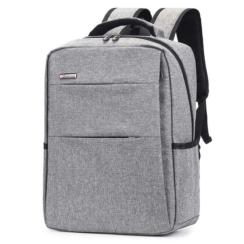 Waterproof and shockproof rechargeable laptop backpack in grey, made from durable Oxford cloth, designed for travel and daily use.