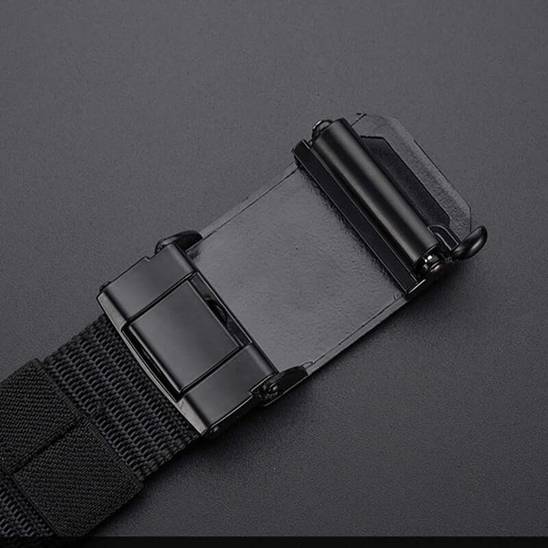 Close-up of a black automatic buckle on a men's canvas belt, showcasing the electroplating treatment and sturdy design.