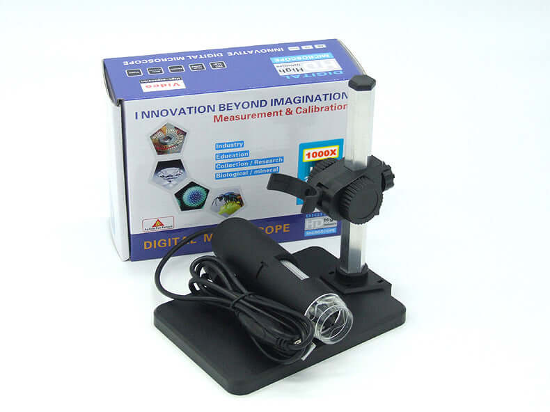 USB microscope camera with adjustable focus, bright LED illumination, and calibration box for detailed imaging.