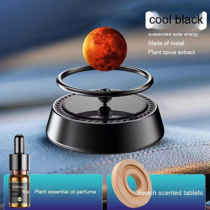 Solar energy rotating car aromatherapy ornament with metal base, floating planet, and essential oil kit.