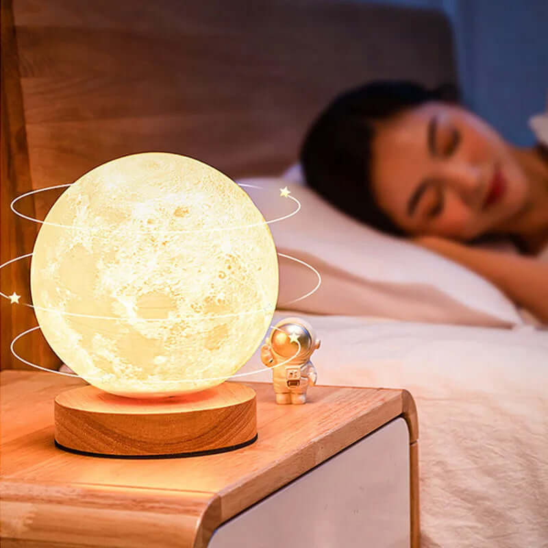 Creative 3D magnetic levitating moon lamp on bedside table, providing warm light for restful sleep.
