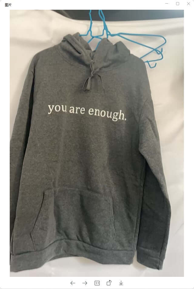 Gray hoodie with the phrase 'you are enough.' printed in white on the front, featuring a kangaroo pocket.