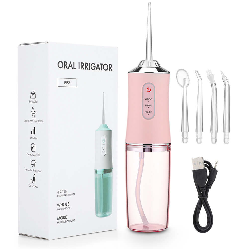 Hand-held electric dental irrigator in pink with USB cable and replacement nozzles, designed for effective oral hygiene.