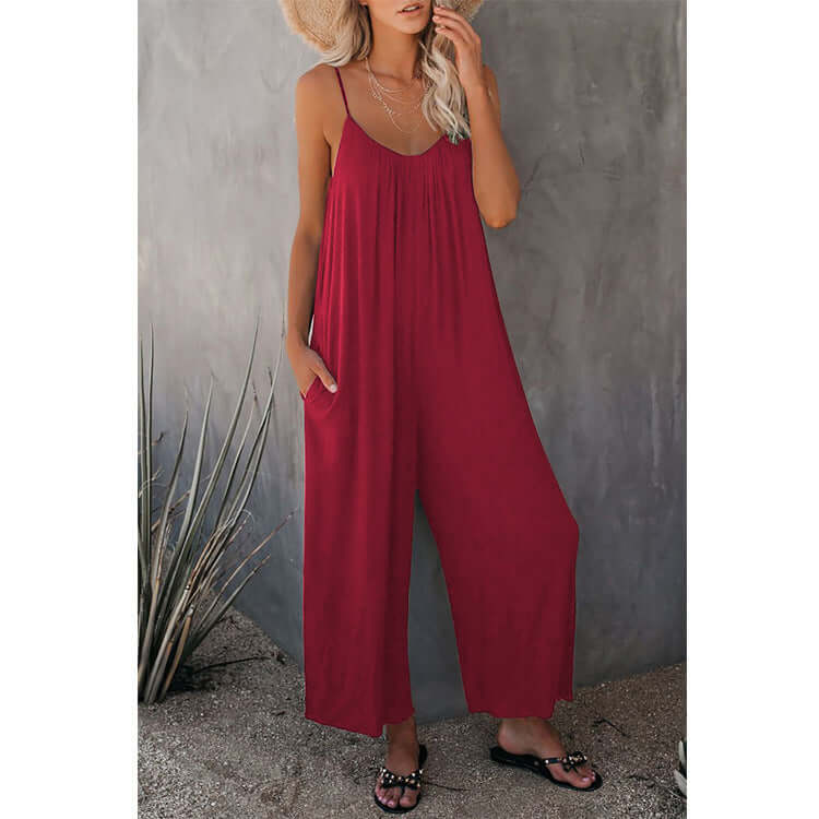 Women's loose sleeveless red jumpsuit romper with pockets, perfect for summer casual wear.